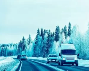 minibus covered by vehicle hire excess insurance driving along road covered in snow